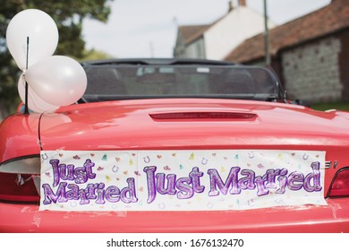 Just Married Sign Banner On Bumper Back Of Car