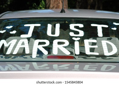 Just Married Sign Painted On Back Car Window.