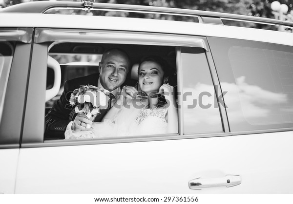 Just\
married at the wedding car looked from\
window