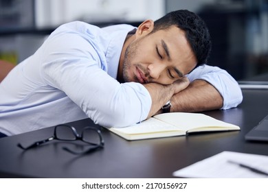I just need a few minutes. Shot of an exhausted businessman having a quick nap on the desk at work. - Shutterstock ID 2170156927
