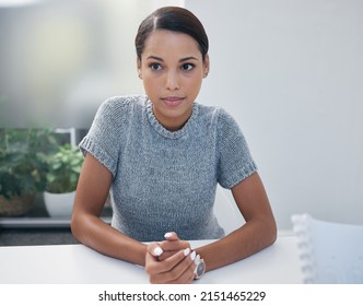 I Just Need To Stay Calm. Shot Of A Young Businesswoman Sitting In On A Meeting In An Office.