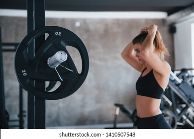 Just One Moment. Photo Of Gorgeous Blonde Woman In The Gym At Her Weekend Time.