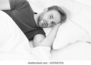 Just One More Minute In Bed. Sleepy Man Lying In Bed On Waking In The Morning. Tired Man Falling Sleep In Bed. Its Bed For Me.