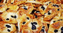 Just Removed From The Toaster Are Numerous Breads Topped With Sugar, Cheese, And Raisins Look Delicious.