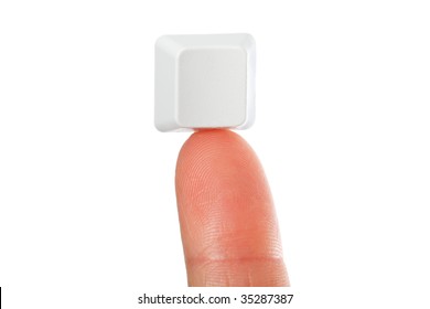 Just a small empty key from a computerkeyboard on fingertip, white background