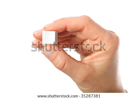 Just a small empty key from a computerkeyboard in hand, white background