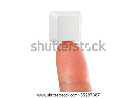 Just a small empty key from a computerkeyboard on fingertip, white background