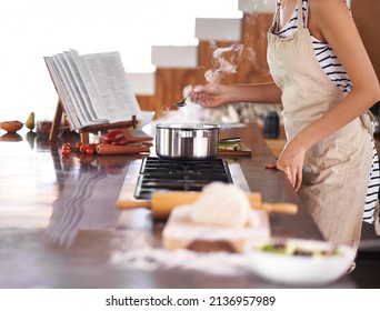 Just The Way Mom Did It. Young Woman Cooking In A Kitchen.