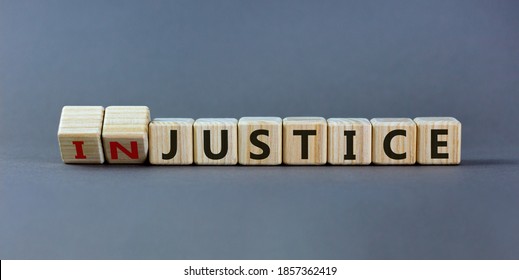 Justice instead of injustice. Turned cubes and changed the word 'injustice' to 'justice' on wooden cubes. Beautiful grey background, copy space. Business concept. - Shutterstock ID 1857362419