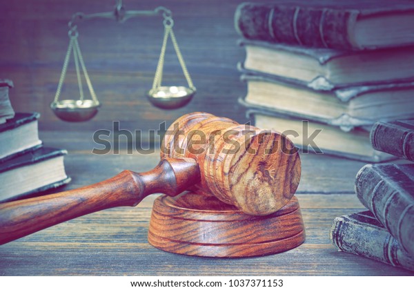 Justice And Law Concept. Judge\
 Gavel, Law Book And Scale Of Justice In The Courtroom  On Wooden\
Table