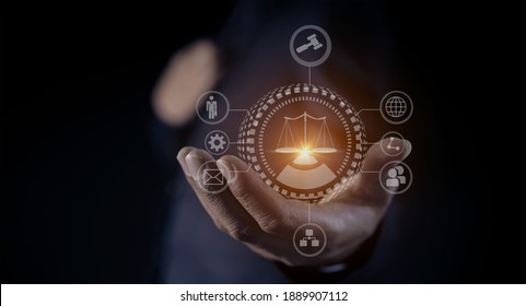 Justice and law concept. Lawyer businessman holding law innovation network icons. blurred background. - Shutterstock ID 1889907112