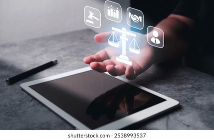 Justice and law concept. Lawyer businesswoman holding holographic interface of law innovation network while using digital tablet. - Powered by Shutterstock