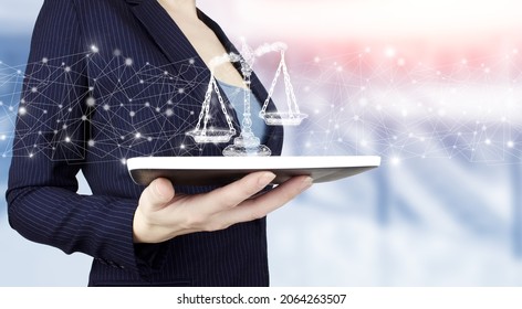 Justice and law concept. Legal advice. Hand hold white tablet with digital hologram Labor Law sign on light blurred background. Labor Law Lawyer Legal Business - Shutterstock ID 2064263507