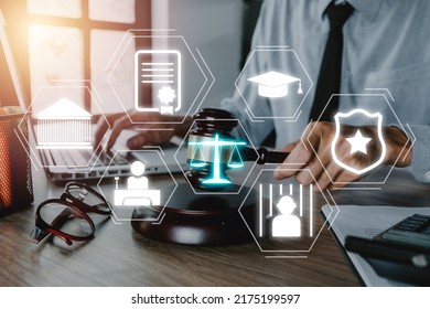 Justice And Law Concept, Male Judge Working On Laptop Computer With VR Screen Law Icon Background.