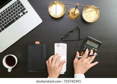 Justice And Law Concept.businessman Or Lawyer Or Accountant Working On Accounts Using A Calculator And Laptop Computer And Documents In Modern Office