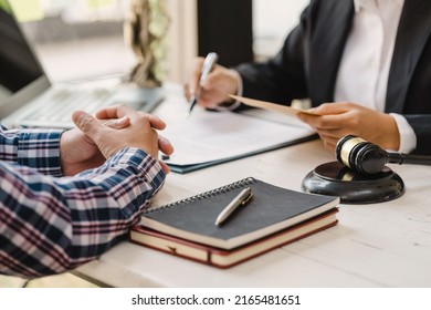 Justice lawyer meeting with contract papers and Judge gavel on tabel in courtroom. Attorney working in courtroom. Justice and law, attorney, court judge concept. - Shutterstock ID 2165481651