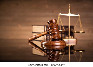 Justice Legal And Jurisprudence Concept. Law Books On Lawyer Desk At Law Firm.