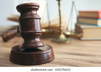 Justice legal and jurisprudence concept. Law books on lawyer desk at law firm.