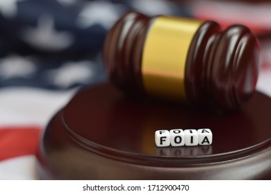 Justice mallet and FOIA acronym. Freedom of information act