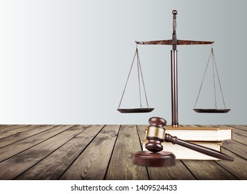 Justice Scales and books with wooden gavel on table. Justice concept