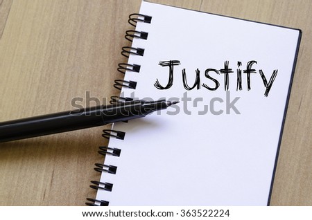 Justify text concept write on notebook with pen