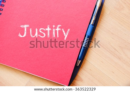 Justify text concept write on notebook with pen
