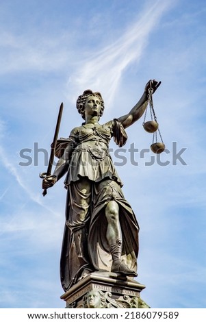 Justitia - Lady Justice . sculpture at the Roemerberg in Frankfurt, built in 1887.