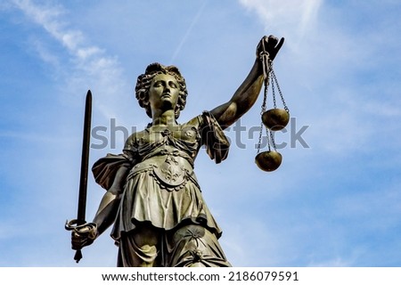 Justitia - Lady Justice . sculpture at the Roemerberg in Frankfurt, built in 1887.