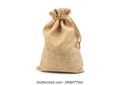 A jute bag full of money isolated on a white background.