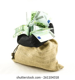 Jute Bag Full Of Money On White Background