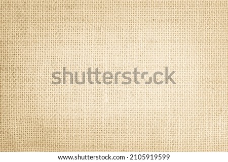 Jute hessian sackcloth burlap canvas woven texture background pattern in light beige cream brown color blank. Natural weaving fiber linen and cotton cloth texture as clean empty for decoration.