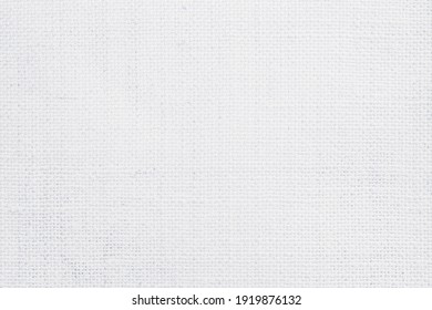 Jute hessian sackcloth canvas woven texture pattern background in light white color blank empty.