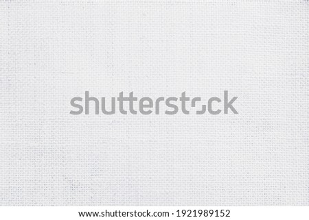 Jute hessian sackcloth canvas woven texture pattern background in light white color blank empty.