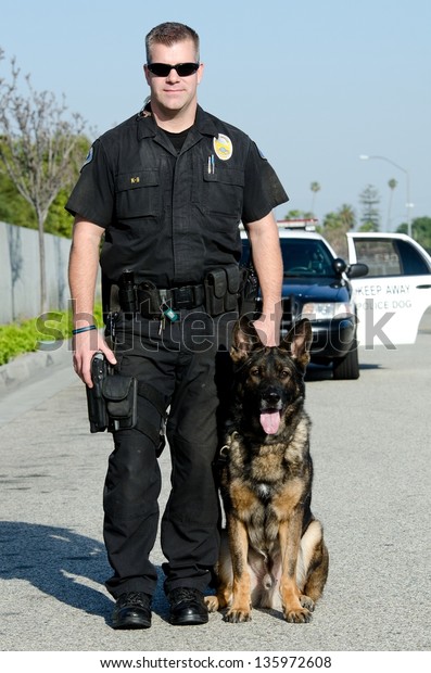 A K9 police officer with\
his dog.