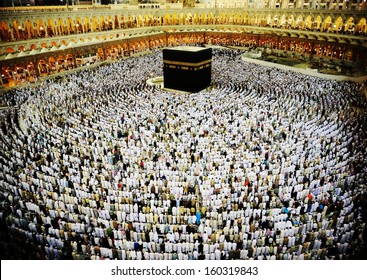 Kaaba in Mecca, Muslim people praying together at holy place