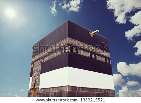 Kaaba with sky and sun