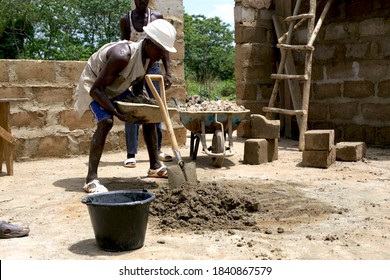 Kabala, Sierra Leone - May 29th 2019: Young African Working In Construction In Africa. Construction And Industry Context