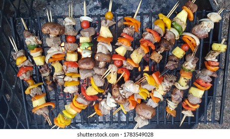 Kabobs Cooking Over An Open Campfire