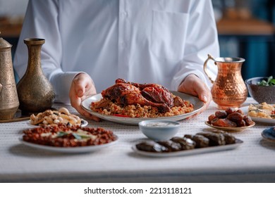 Kabsa, hummus, maqluba, maqluba, tabbouleh close-up, rice and meat dish, middle eastern national traditional food. Muslim family dinner, Ramadan, iftar. Arabian cuisine.