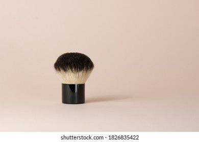 Kabuki Makeup Brush Stands On A Pink Background. Cosmetics. Accessories.