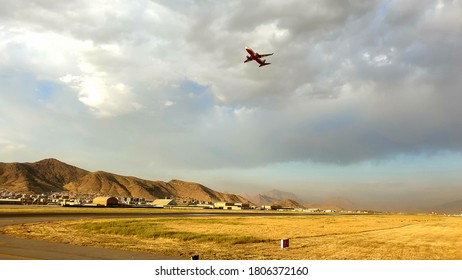 Kabul, Afghanistan, 29/06/19. Boeing 737 Passenger Aircraft Departing From Hamid Karzai International Airport In Kabul During Sunset. Airport Buildings And Mountains In The Background.