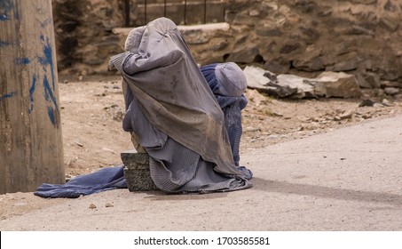 Kabul, Afghanistan April 2004: Women In Burqas On Kabul Roadside