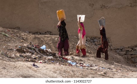 Kabul, Afghanistan, Mar 2004: Women Carrying Water In Kabul, Afghanistan