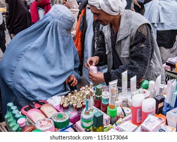 Kabul, Afghanistan, March 2005: Woman Buys Toiletries From Kabul Market Stall