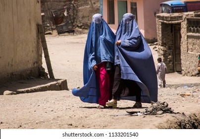 Kabul, Afghanistan, May 2004: Afghan Women In Burqas Walking In The Street In Kabul