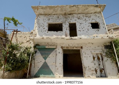 Kafranbel, Idlib, Syria. June 21st 2013 
A Bullet Riddled Building In The War Torn Town Of Kafra Nabl In Idlib Province Of Northwest Syria  
