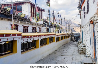 Kagbeni, Nepal - 03.06.2017: Mani Wall and Tibetan Buddhist prayer wheels in Kagbeni village, Annapurna Circuit