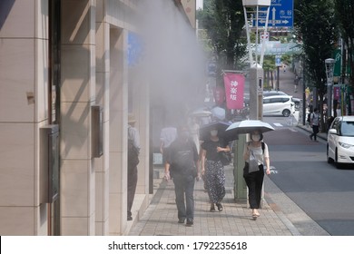 Kagurazaka, Tokyo, Japan - August 8 2020: Water Mist Sprays From Stores On A Shopping Street To Alleviate The Tokyo Summer Heat.