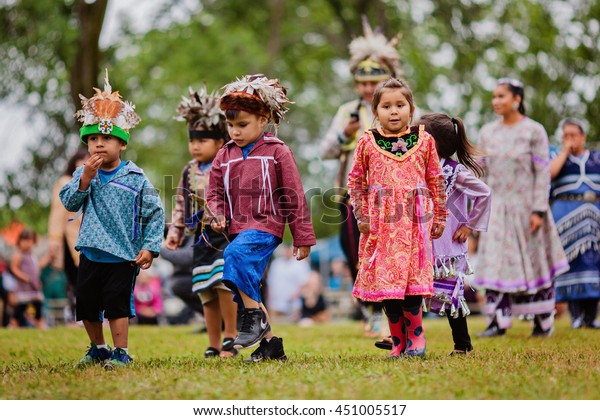 Kahnawake, Quebec, Canada - July 10, 2016 : Pow\
wow little kids take part in Kahnawake 26th Annual Echoes Of A\
Proud Nation Pow Wow in Kahnawake\
reserve