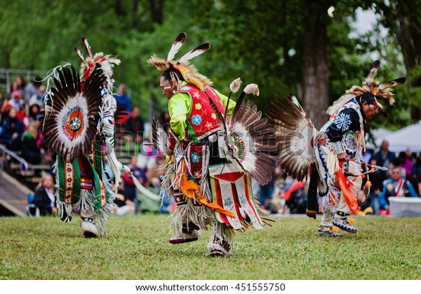 Kahnawake, Quebec, Canada - July 10, 2016 : Pow\
wow elder men dancers take part in Kahnawake 26th Annual Echoes Of\
A Proud Nation Pow Wow in Kahnawake reserve. Elder men 45-59 years\
old category.
